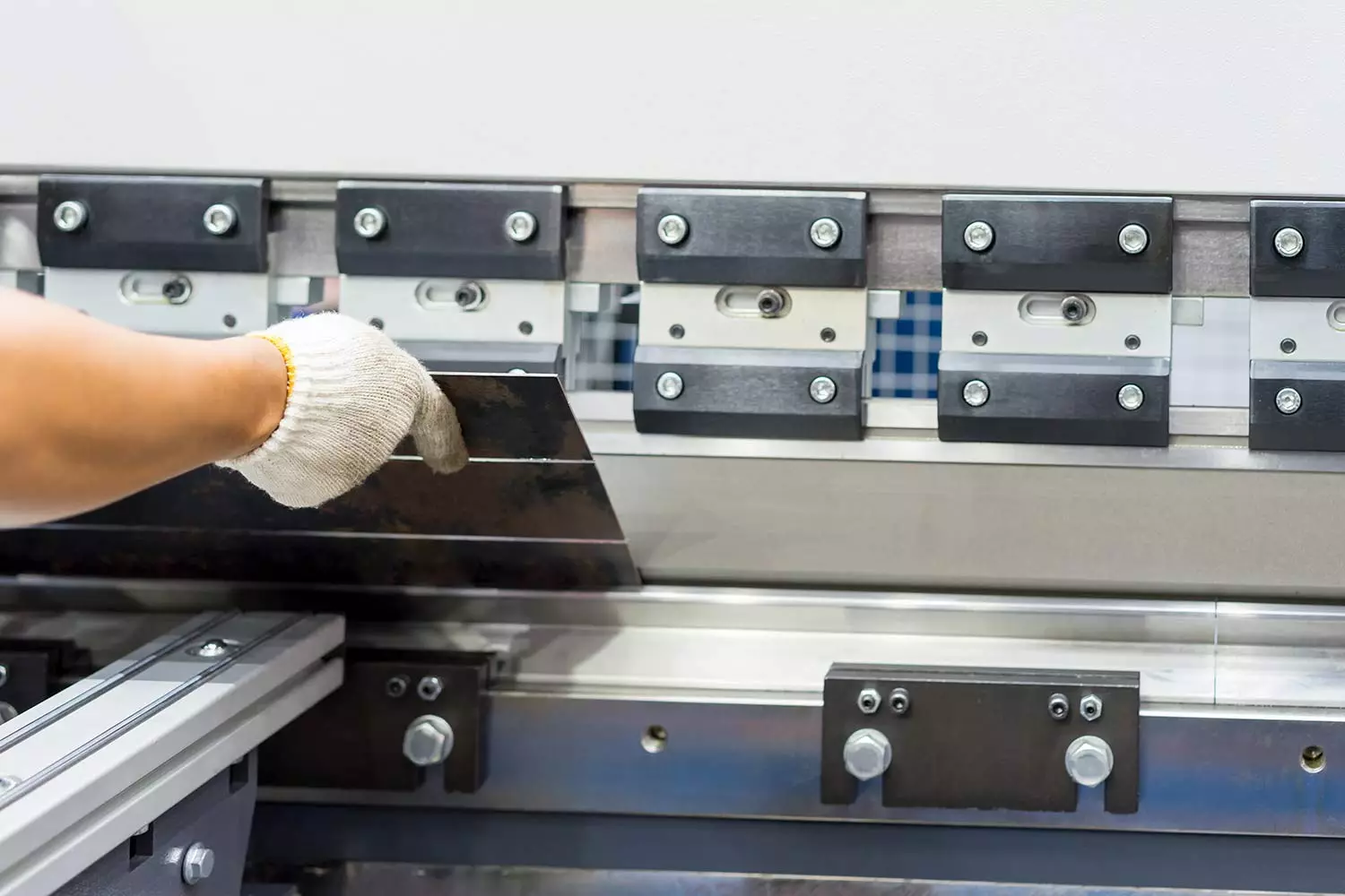 Operator Working Cut Bending Iron Operator working cut and bending metal sheet by high precision metal sheet bending machine, cnc control metal sheet bending machine in factory